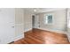 Cozy bedroom boasting hardwood floors, fresh paint, updated ceiling fan, and natural light at 904 Edgewood Cir, Gastonia, NC 28052