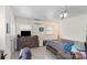 Well lit bedroom with hardwood floors, ceiling fan and a dresser at 904 Edgewood Cir, Gastonia, NC 28052