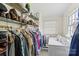 Walk-in closet includes washer, dryer, shelving and a window at 904 Edgewood Cir, Gastonia, NC 28052