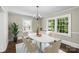 Elegant dining room with a chandelier, large windows and bright natural light at 904 Edgewood Cir, Gastonia, NC 28052