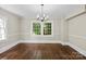 Dining room with original hardwood floors, lots of natural light and neutral walls at 904 Edgewood Cir, Gastonia, NC 28052