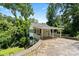 White exterior with covered porch and landscaping at 904 Edgewood Cir, Gastonia, NC 28052