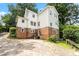Two-story brick and vinyl house with a cracked concrete driveway at 904 Edgewood Cir, Gastonia, NC 28052