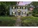 Traditional two-story home with a front yard, and covered porch at 904 Edgewood Cir, Gastonia, NC 28052