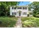 Charming two-story home with classic white siding, black shutters, and a well-manicured front yard at 904 Edgewood Cir, Gastonia, NC 28052
