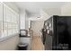 Kitchen with black refrigerator, granite countertops and view of window at 904 Edgewood Cir, Gastonia, NC 28052