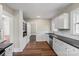 Charming kitchen with white cabinetry, stainless appliances, and hardwood flooring at 904 Edgewood Cir, Gastonia, NC 28052