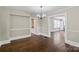 An elegant living room with hardwood floors, wainscoting and an ornate chandelier at 904 Edgewood Cir, Gastonia, NC 28052