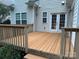 Relaxing back deck area featuring French doors, privacy fencing, and access to the yard at 9212 John Hawks Rd, Cornelius, NC 28031