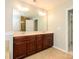 Spacious bathroom featuring double vanity, large mirror, and tile flooring at 9212 John Hawks Rd, Cornelius, NC 28031