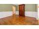 Dining room with wood floors, wainscoting and vintage china cabinet at 9212 John Hawks Rd, Cornelius, NC 28031