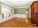 Open dining room with hardwood floors and plenty of natural light from the bay window at 9212 John Hawks Rd, Cornelius, NC 28031