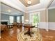 Warm and inviting foyer with hardwood floors and a view of the living room and staircase at 9212 John Hawks Rd, Cornelius, NC 28031