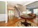 Foyer showcasing staircase, hardwood floors, and decorative details at 9212 John Hawks Rd, Cornelius, NC 28031
