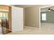 Hallway featuring a doorway to one bedroom, and a partial view of another room and stairway at 9212 John Hawks Rd, Cornelius, NC 28031