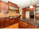 Spacious kitchen with wooden cabinets, stainless steel appliances, and granite countertops at 9212 John Hawks Rd, Cornelius, NC 28031