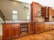 Kitchen featuring built-in wine racks, baskets, and granite countertops at 9212 John Hawks Rd, Cornelius, NC 28031