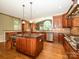 Gourmet kitchen with stainless steel appliances, granite countertops, and wooden cabinets at 9212 John Hawks Rd, Cornelius, NC 28031
