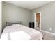 Comfortable bedroom with a view into the bathroom, neutral walls, and comfortable carpeting to make it your own at 9221 Widden Way, Charlotte, NC 28269