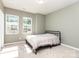 Cozy bedroom with natural light from two windows, neutral walls, and comfortable carpeting to make it your own at 9221 Widden Way, Charlotte, NC 28269