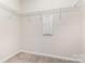Walk-in closet with carpet and wire shelving, ready to organize wardrobes and personal items at 9221 Widden Way, Charlotte, NC 28269