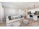 This spacious living room flows into the kitchen and offers ample seating, making it great for entertaining at 9221 Widden Way, Charlotte, NC 28269