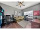 Comfortable bedroom with hardwood floors, a ceiling fan, and two computer desks with chairs at 9429 Coast Laurel Nw Ave, Concord, NC 28027