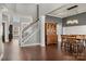 Bright foyer with hardwood floors, stairway, leading into the dining room and living room beyond at 9429 Coast Laurel Nw Ave, Concord, NC 28027