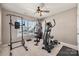 Bright gym with large window and ceiling fan, weights, and carpet at 9429 Coast Laurel Nw Ave, Concord, NC 28027