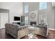 Bright and spacious living room boasts hardwood floors, a cozy fireplace, and contemporary decor at 9429 Coast Laurel Nw Ave, Concord, NC 28027