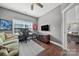 Bright office with wood floors, gray walls, large window, ceiling fan, and desk at 9429 Coast Laurel Nw Ave, Concord, NC 28027