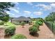 Large, landscaped backyard with a fence for privacy at 101 Harvest Farm Ct, Mount Holly, NC 28120