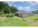 Spacious backyard featuring a well-maintained lawn and mature landscaping at 101 Harvest Farm Ct, Mount Holly, NC 28120
