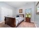 Cozy bedroom featuring a queen-sized sleigh bed and natural light at 101 Harvest Farm Ct, Mount Holly, NC 28120
