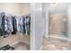 Walk-in closet and full bathroom featuring tiled walk-in shower at 101 Harvest Farm Ct, Mount Holly, NC 28120