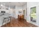 Bright dining area next to the kitchen with hardwood floors and natural light at 101 Harvest Farm Ct, Mount Holly, NC 28120