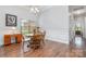 Cozy dining room with hardwood floors, traditional furniture, and natural lighting at 101 Harvest Farm Ct, Mount Holly, NC 28120