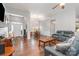 Open living space with hardwood floors, comfortable seating, natural light, and a view to other rooms at 101 Harvest Farm Ct, Mount Holly, NC 28120