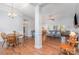 Bright and airy living room featuring hardwood floors, ample seating, and an open floor plan at 101 Harvest Farm Ct, Mount Holly, NC 28120