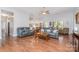 Large living room features hardwood floors, neutral paint, and comfortable seating at 101 Harvest Farm Ct, Mount Holly, NC 28120