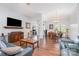 Expansive living room with hardwood floors, comfortable seating, and seamless flow into other areas at 101 Harvest Farm Ct, Mount Holly, NC 28120
