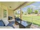 Relaxing screened-in patio with outdoor furniture and view of the backyard at 101 Harvest Farm Ct, Mount Holly, NC 28120