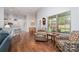 Comfortable seating area boasts natural light, hardwood floors, and neutral color scheme at 101 Harvest Farm Ct, Mount Holly, NC 28120