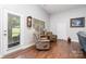 Cozy sitting area featuring comfortable furniture, natural light, and hardwood floors at 101 Harvest Farm Ct, Mount Holly, NC 28120