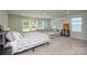 Bright bedroom with multiple windows and a comfortable seating area at 10209 Mamillion Dr, Huntersville, NC 28078