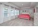 Spacious bedroom featuring large windows with neutral walls and carpeted floors at 10209 Mamillion Dr, Huntersville, NC 28078