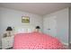 Cozy bedroom with a comfortable bed, stylish lamps, and modern decor at 10209 Mamillion Dr, Huntersville, NC 28078