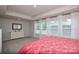 Bright bedroom featuring large windows with neutral walls and carpeted floors at 10209 Mamillion Dr, Huntersville, NC 28078