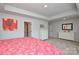 Bright bedroom with large windows, with two dressers, neutral walls and carpeted floors at 10209 Mamillion Dr, Huntersville, NC 28078