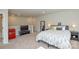 Spacious bedroom featuring an adjacent bathroom, TV, and mini fridge at 10209 Mamillion Dr, Huntersville, NC 28078